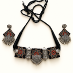 Black-Printed-Fabric-Necklace-Set-with-Silver-Tone-Charms-on-Display
