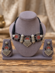 Black-Printed-Fabric-Necklace-Set-with-Silver-Tone-Charms-on-Display