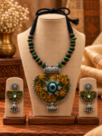 Mustard Ajrakh Fabric Mirror Work Necklace Set with Green Beads & Jhumkas