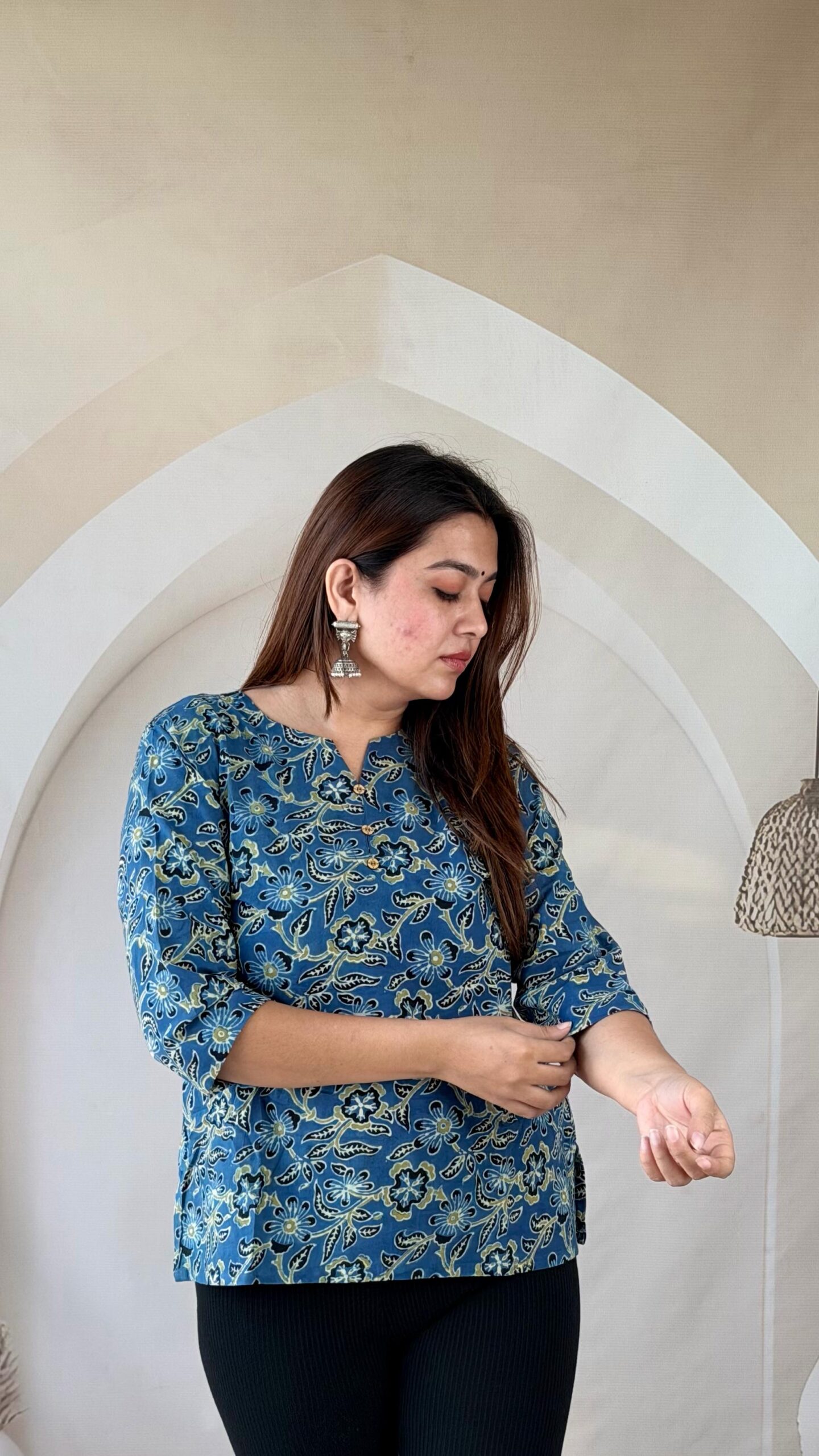 PHOTO-2026-10-12-09-57-53(2) Close-up of indigo blue Ajrakh cotton short kurti showing floral print and three-quarter sleeves
