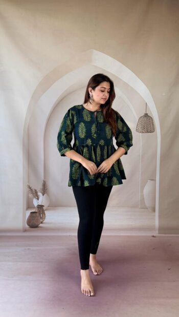 Bottle green Ajrakh cotton peplum short kurti with tree buti and tie-up neck, full front view