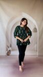 Bottle green Ajrakh cotton peplum short kurti with tree buti and tie-up neck, full front view