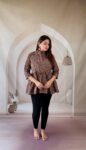 Brown Ajrakh cotton peplum short kurti with red floral creeper and mandarin collar, full front view