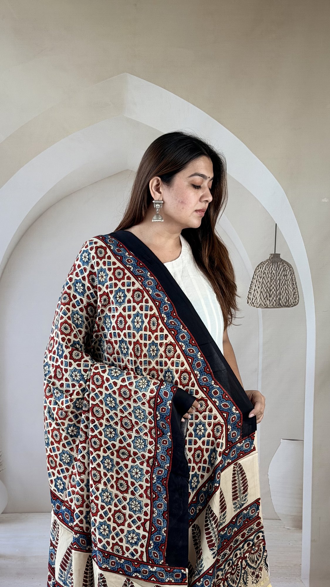 cream-ajrakh-modal silk-dupatta-geometric-lattice-3 Close-up of cream Ajrakh modal silk dupatta with red and indigo geometric lattice and black border
