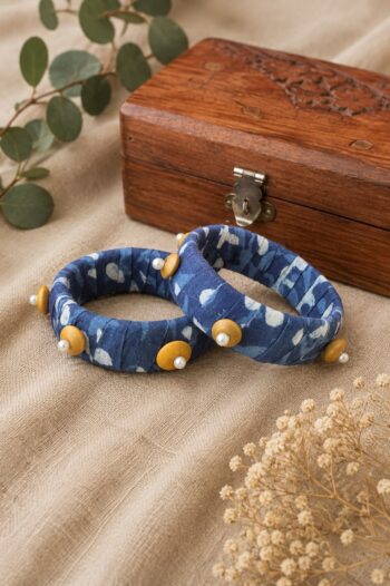 Handcrafted indigo Ajrakh fabric bangles with mustard disc beads and pearls, set of 2