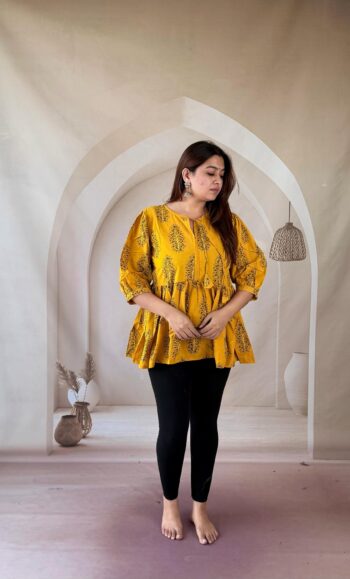 Mustard Ajrakh cotton peplum short kurti with green tree buti and tie-up neck, full front view