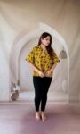 Mustard yellow Ajrakh cotton short kurti with green floral jaal and shirt collar, full front view