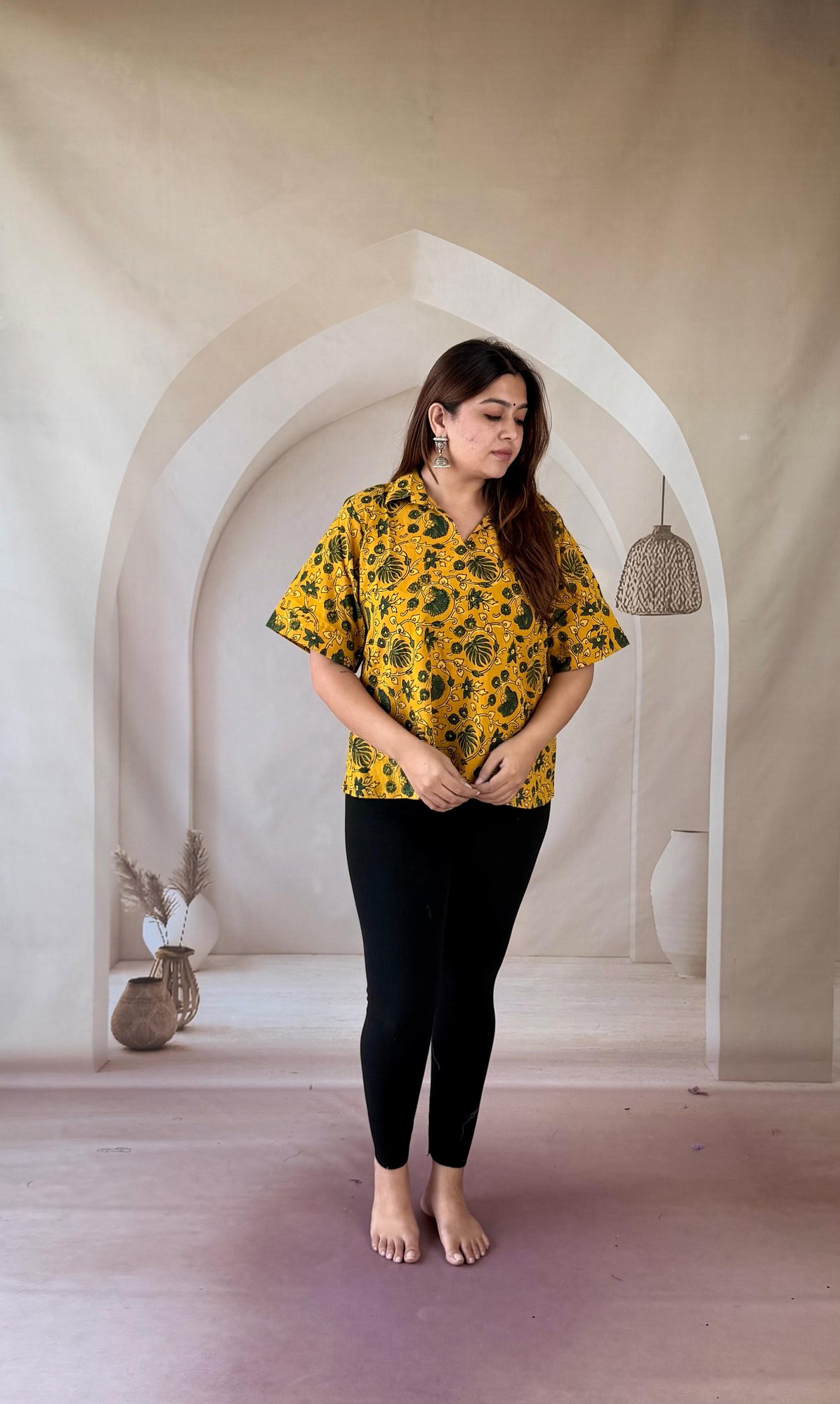 mustard-ajrakh-cotton-short-kurti-collar-neck-1 Mustard yellow Ajrakh cotton short kurti with green floral jaal and shirt collar, full front view