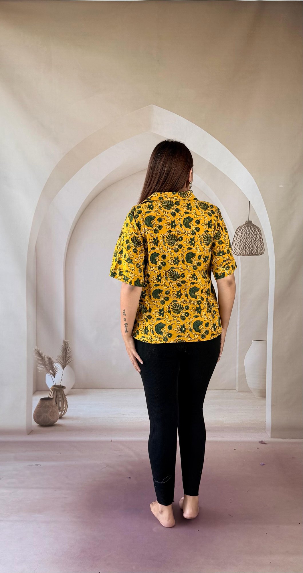 mustard-ajrakh-cotton-short-kurti-collar-neck-3 Back view of mustard yellow Ajrakh cotton short kurti with half sleeves