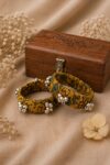 Handcrafted mustard Ajrakh fabric bangles with silver ghungroo bell clusters, set of 2