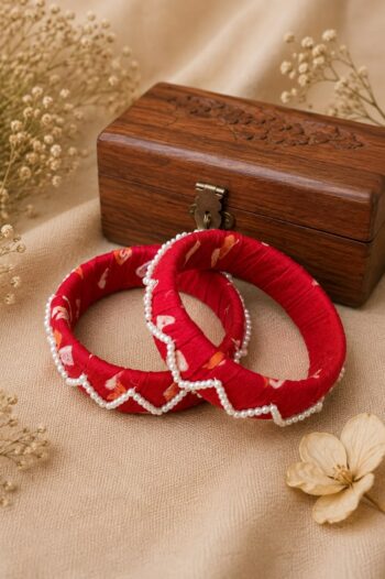 Handcrafted red Ajrakh fabric bangles with scalloped pearl border, set of 2